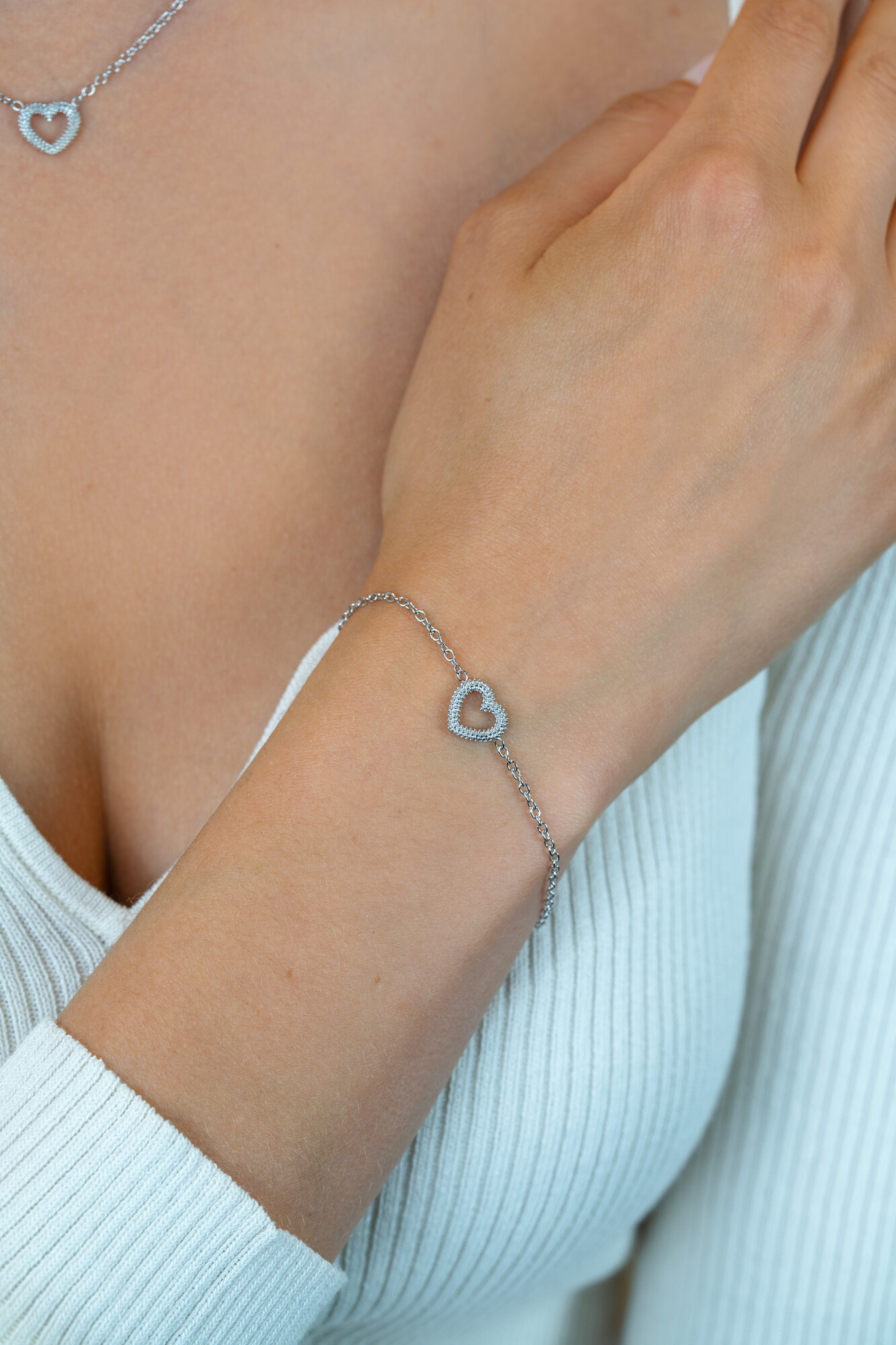 ZINZI zlv. armband met bewerkt open hartje