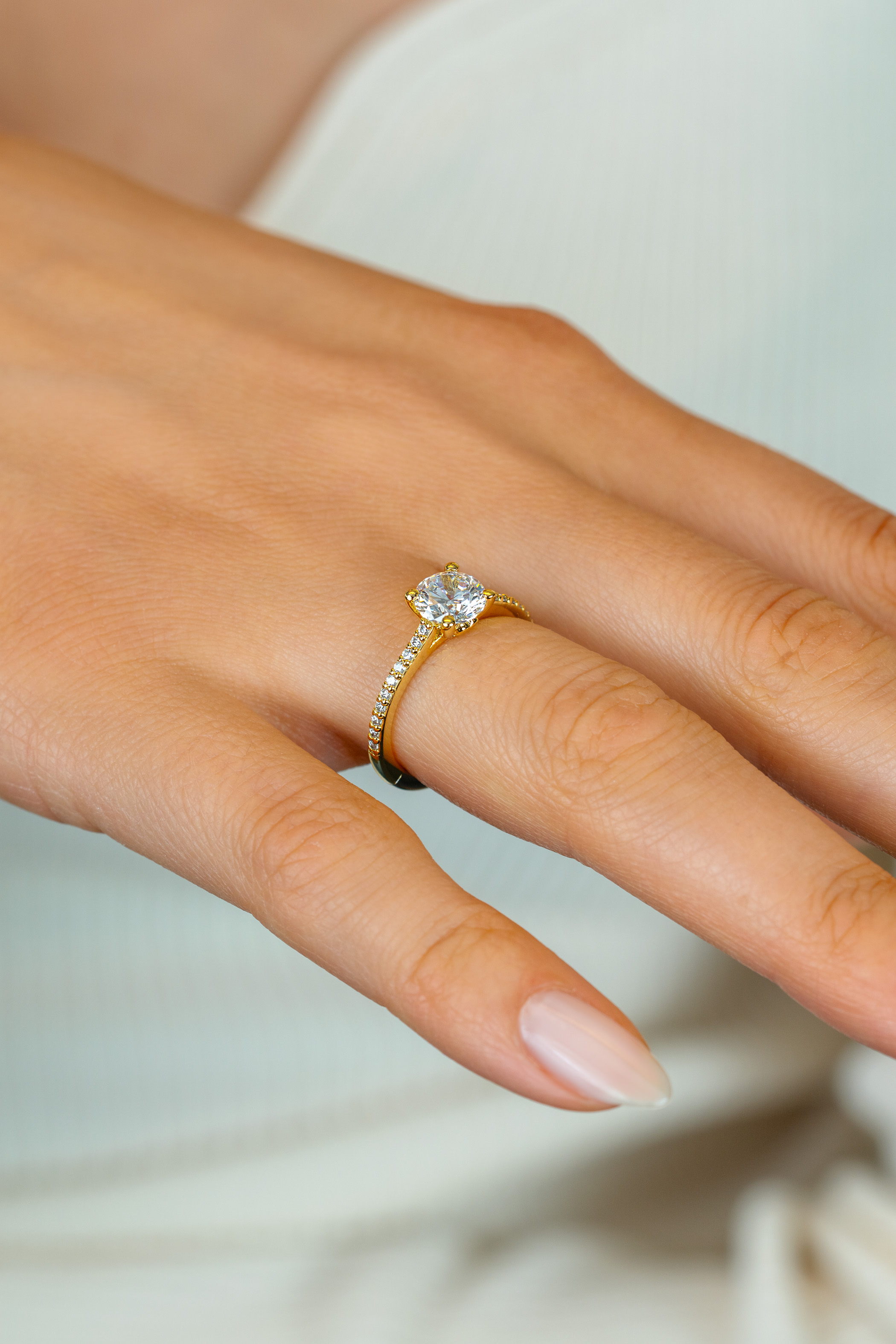 ZINZI gold plated silver engagement ring with a large round white zirconia (6.5mm) in claw setting and small heart on the side ZIR2696Y