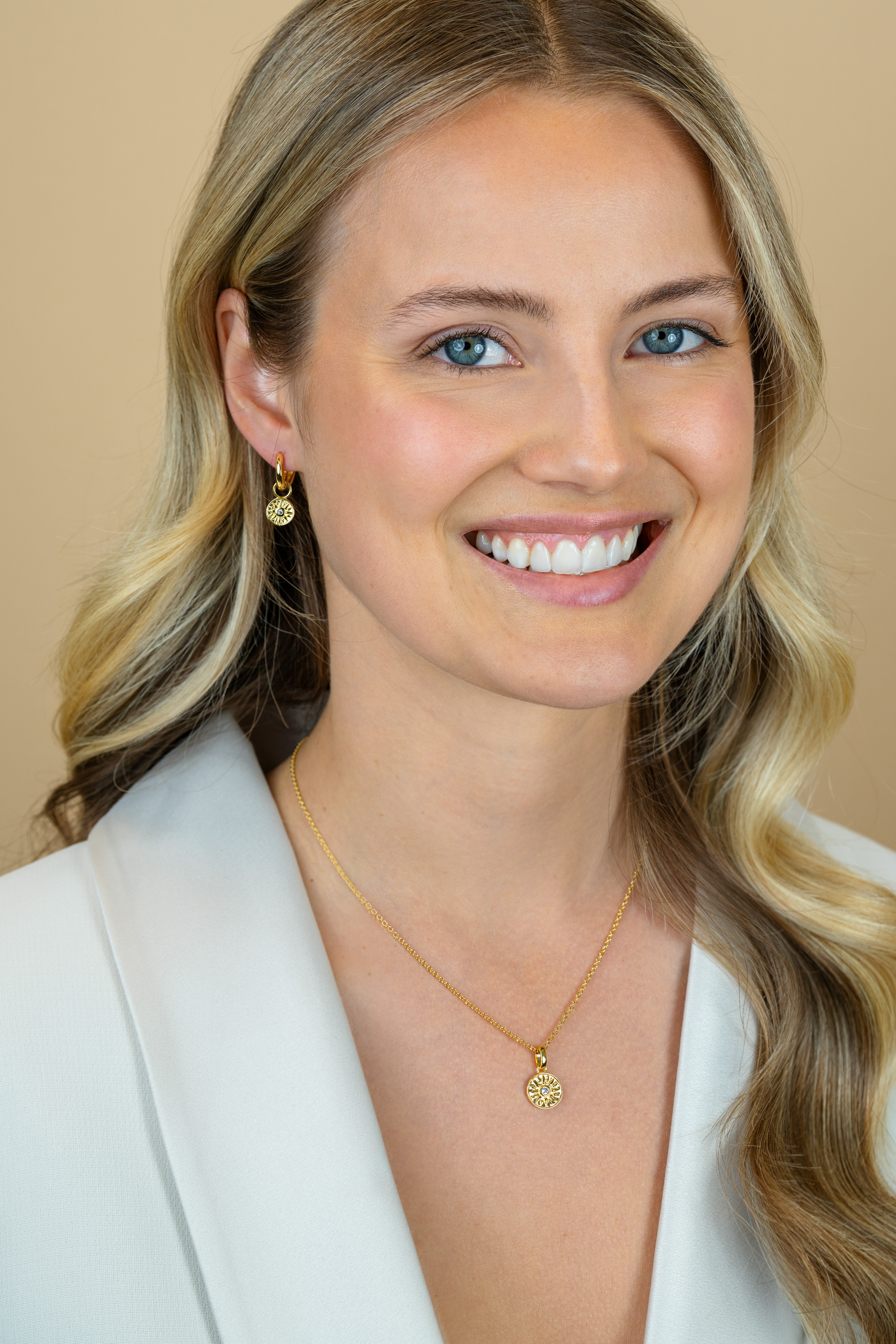 ZINZI zlv. oorbedels gg.verg.rond muntje zon en zirc.