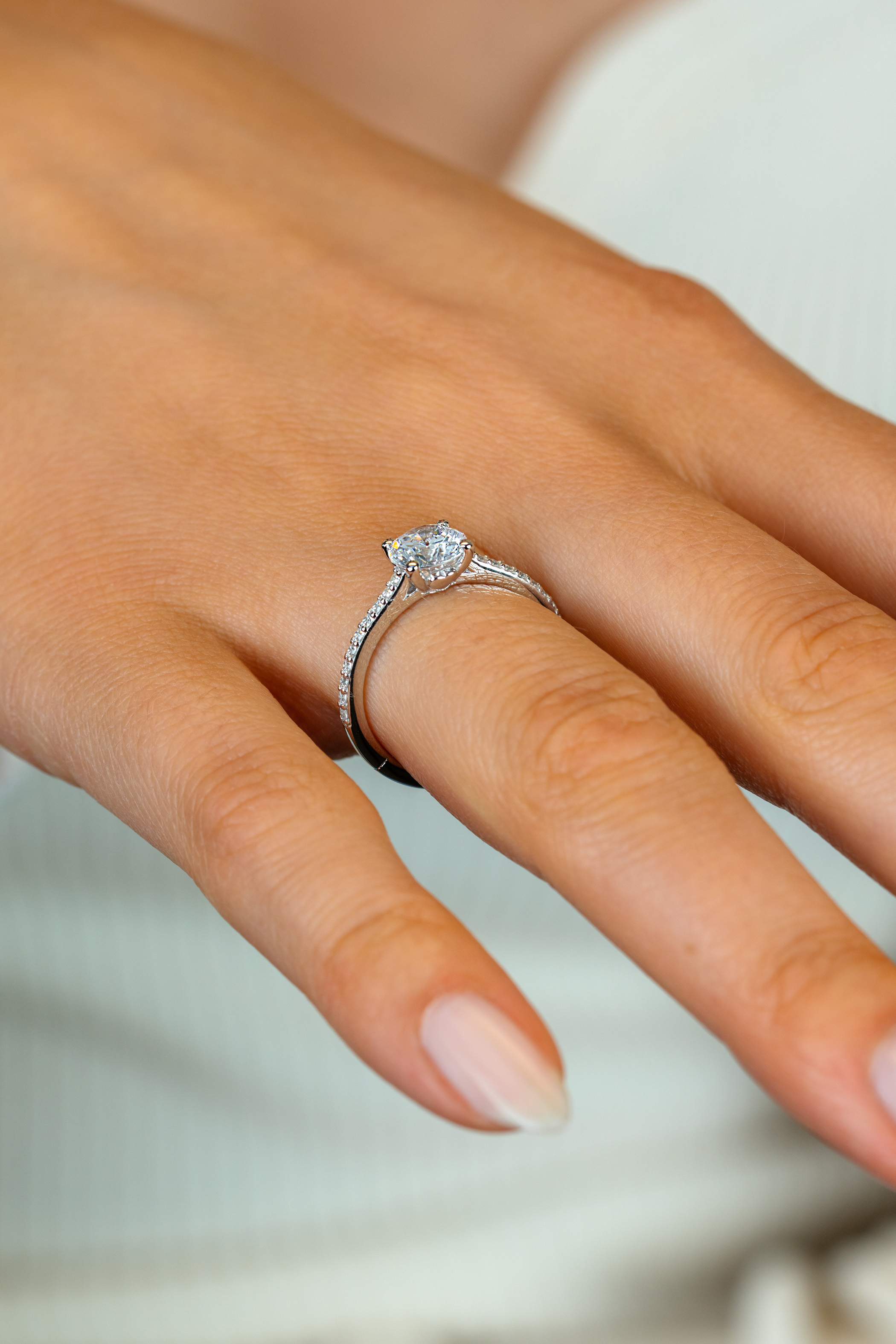 ZINZI silver engagement ring with a large round white zirconia (6.5mm) in claw setting and small heart on the side ZIR2696
