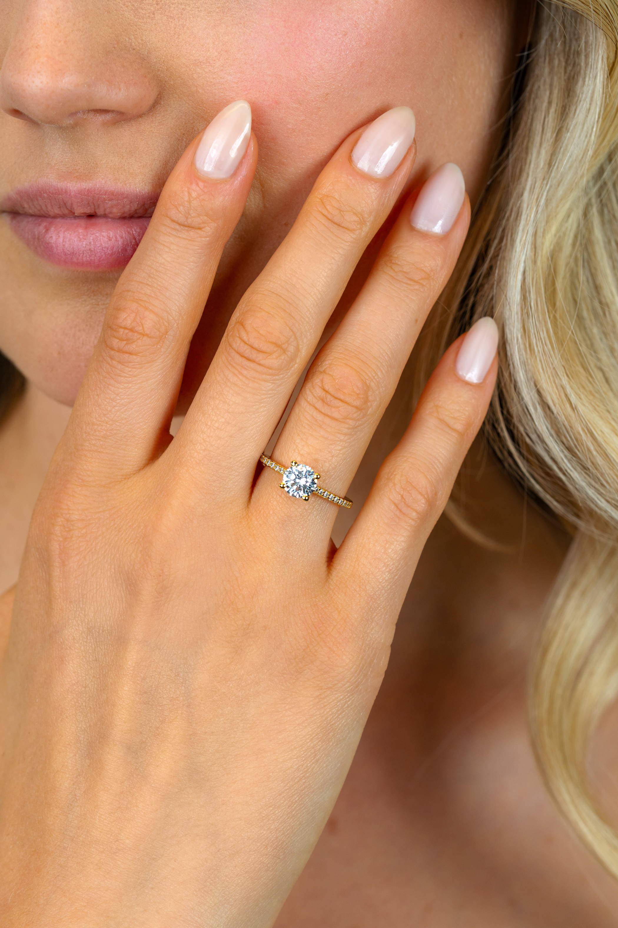 ZINZI gold plated silver engagement ring with a large round white zirconia (6.5mm) in claw setting and small heart on the side ZIR2696Y