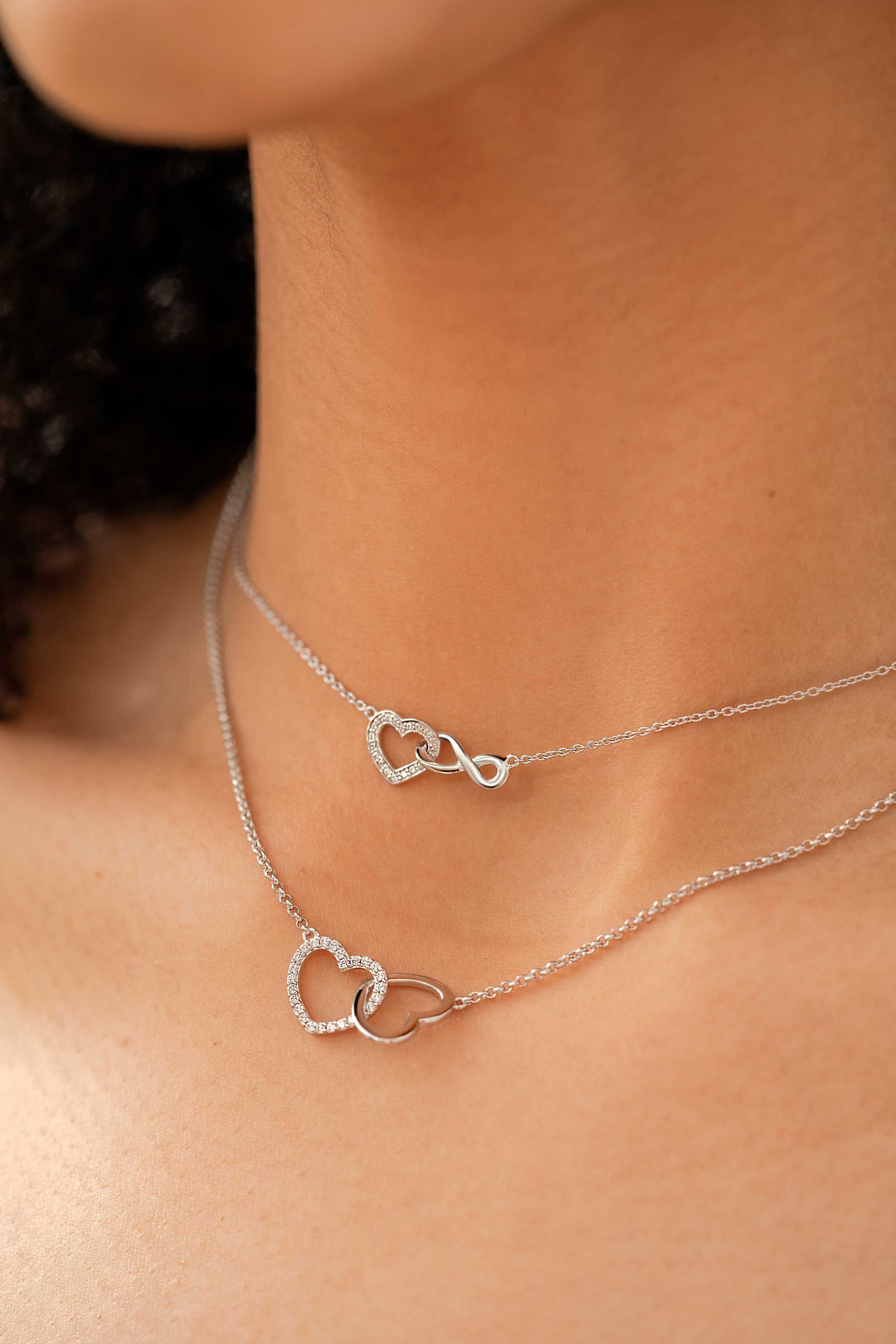 ZINZI silver necklace with Infinity sign connected with an open heart, set with white zirconia 42-45cm ZIC2596