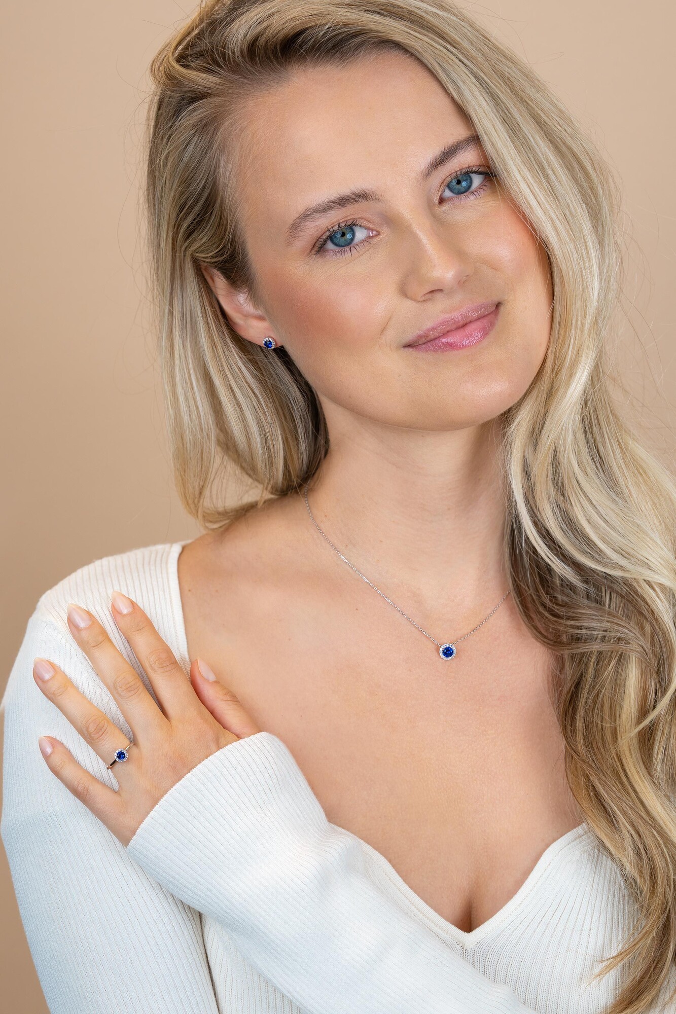 ZINZI zlv. ring entourage blauw en zirconia's mt.62